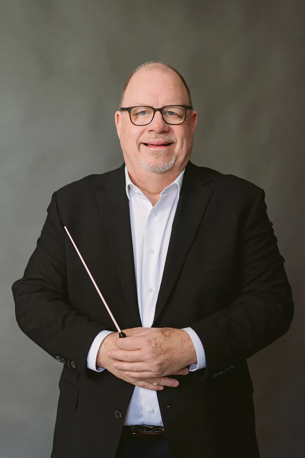 Peter Fudge conducting with baton